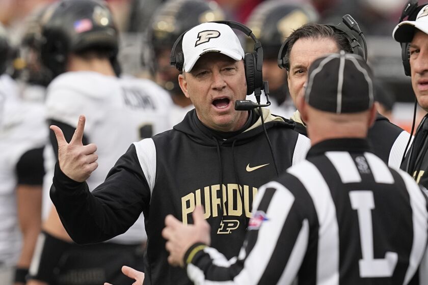 Purdue head coach Jeff Brohm questions a call during the first half of an NCAA college football game against Indiana, Saturday, Nov. 26, 2022, in Bloomington, Ind. (AP Photo/Darron Cummings)