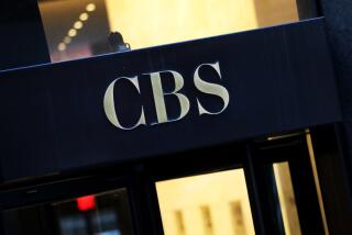 An entrance to a building with the CBS logo written on it