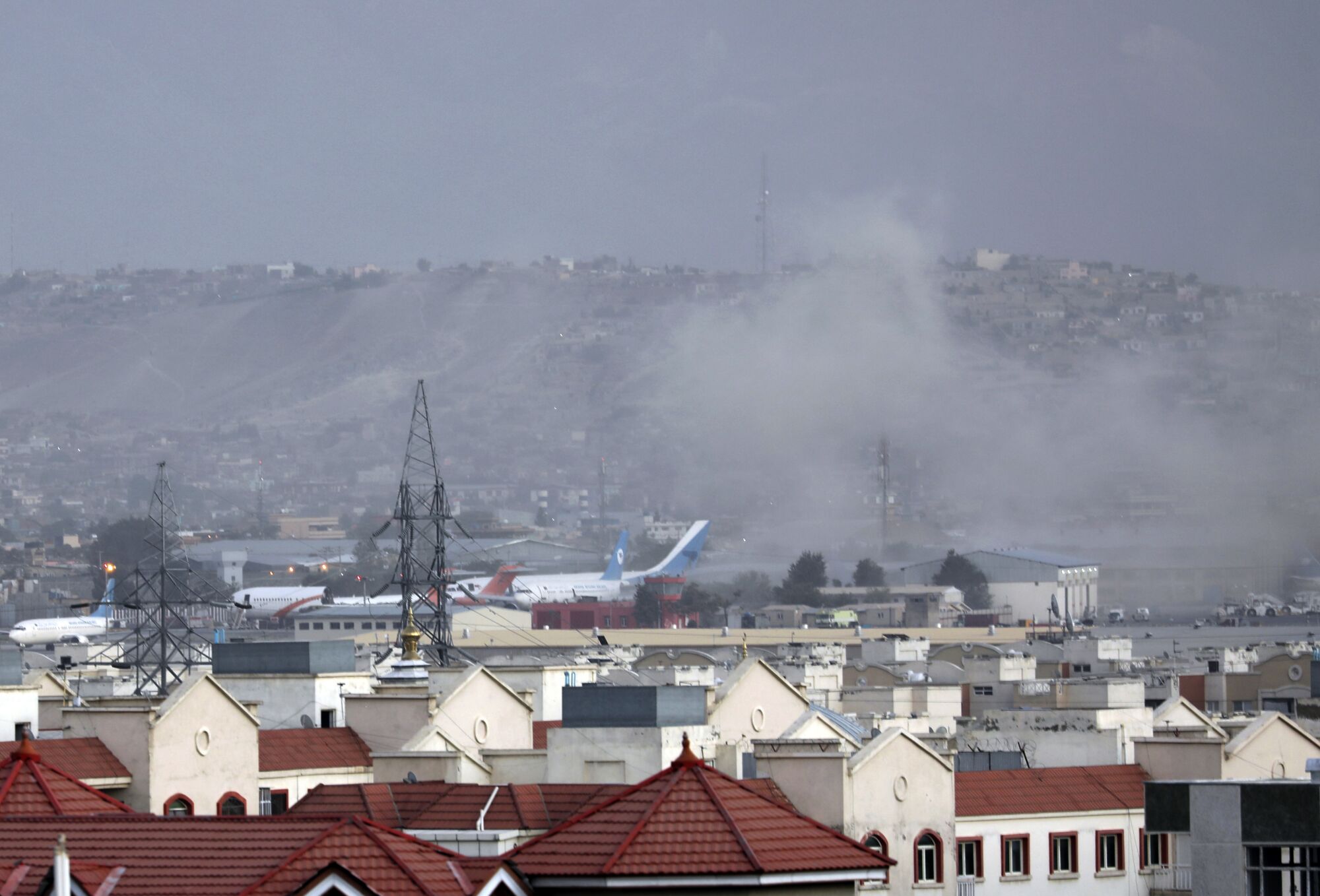 Smoke rises from explosion outside the airport in Kabul, Afghanistan