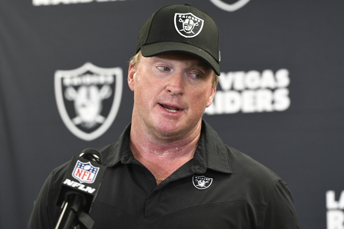 FILE - In this Sept. 19, 2021, file photo, Las Vegas Raiders head coach Jon Gruden meets with the media following an NFL football game against the Pittsburgh Steelers in Pittsburgh. Gruden is out as coach of the Raiders after emails he sent before being hired in 2018 contained racist, homophobic and misogynistic comments. A person familiar with the decision said Gruden is stepping down after The New York Times reported that Gruden frequently used misogynistic and homophobic language directed at Commissioner Roger Goodell and others in the NFL. (AP Photo/Don Wright, File)