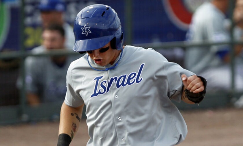 Dodgers prospect Joc Pederson scores a run for Israel during a World Baseball Classic qualifier in 2012. Pederson understands he faces a daunting task in trying to find playing time with the Dodgers in 2014.