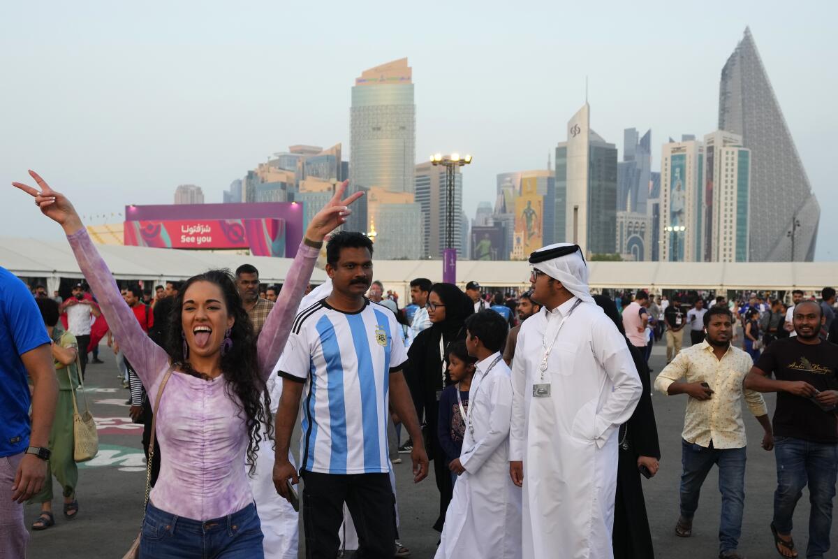 People gather at a fan event for the World Cup in Doha, Qatar, on Saturday.