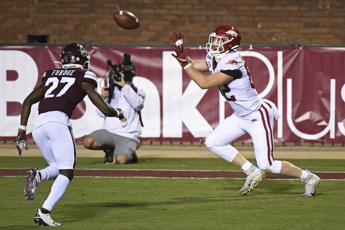 Arkansas tight end Hudson Henry (82) catches a 12-yard touchdown pass during the second half of the team's NCAA college football game against Mississippi State in Starkville, Miss., Saturday, Oct. 3, 2020. Arkansas won 21-14. (AP Photo/Thomas Graning)