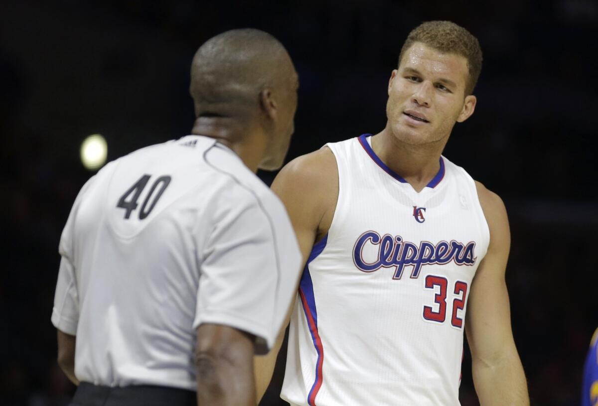 Blake Griffin gets called for a technical foul by referee Leon Wood during a preseason game against the Golden State Warriors on Tuesday at Staples Center.