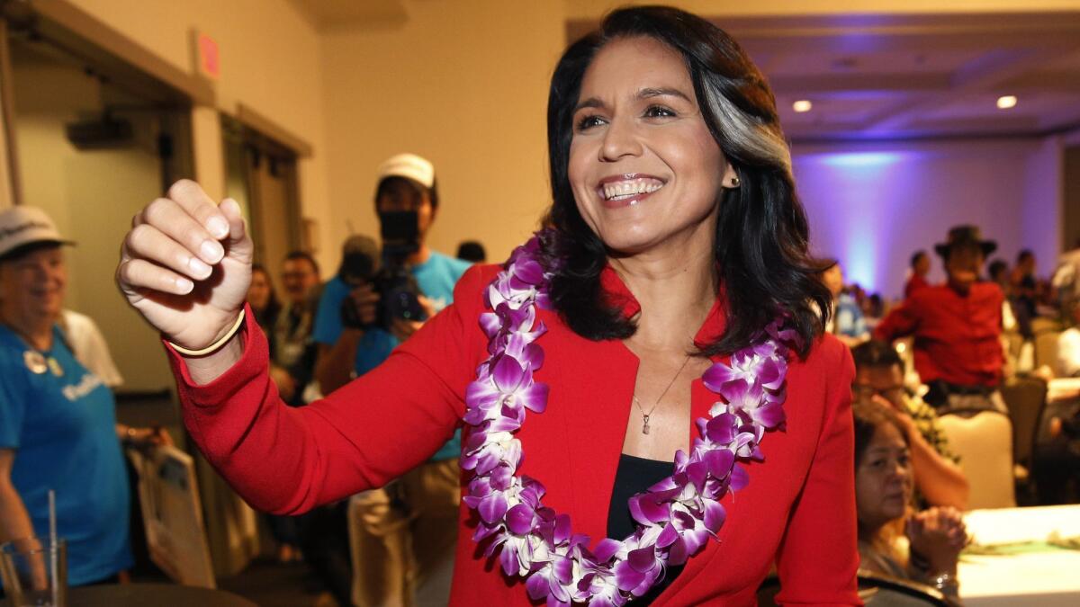 Rep. Tulsi Gabbard (D-Hawaii), who has announced a run for president, greets supporters in Honolulu. Her memoir is scheduled for publication this spring.