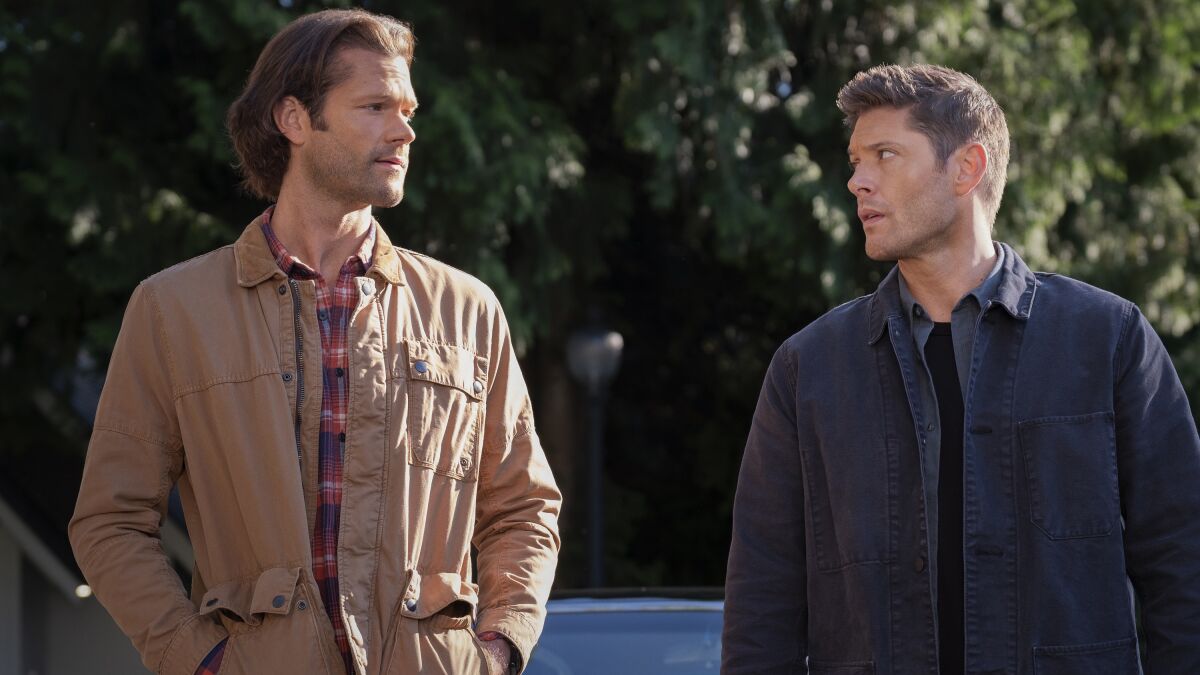 Jared Padalecki and Jensen Ackles look at each other in "Supernatural" on The CW.
