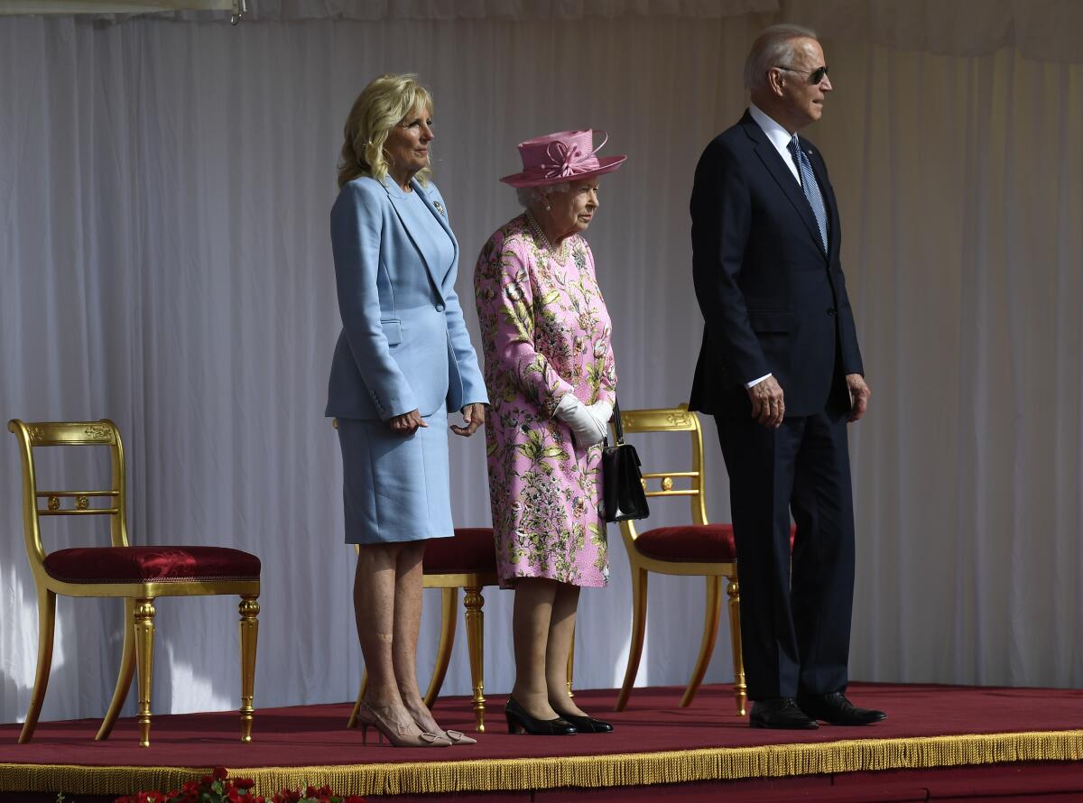 Britain's Queen Elizabeth II stands with President Biden and First Lady Jill Biden at Windsor Castle.