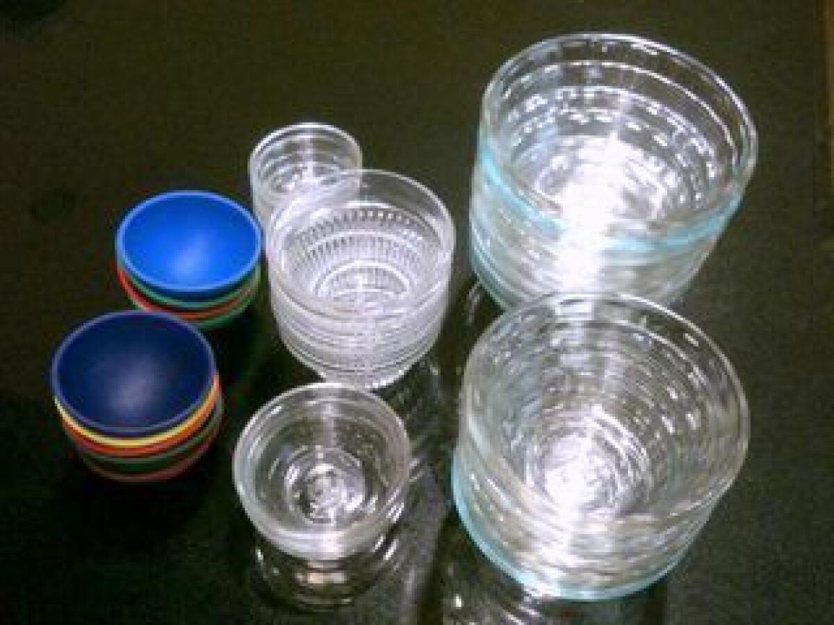 The glass and rubber cups pictured above are handy for holding spices and prepared ingredients until they're ready to go in a recipe, and can be found at many major markets and cooking supply stores.