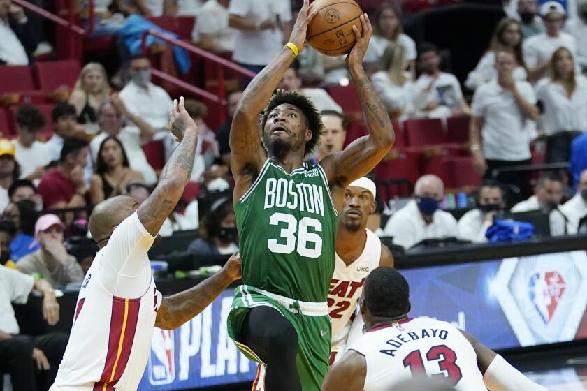 Boston Celtics guard Marcus Smart (36) drives to the basket as Miami Heat forward P.J. Tucker.