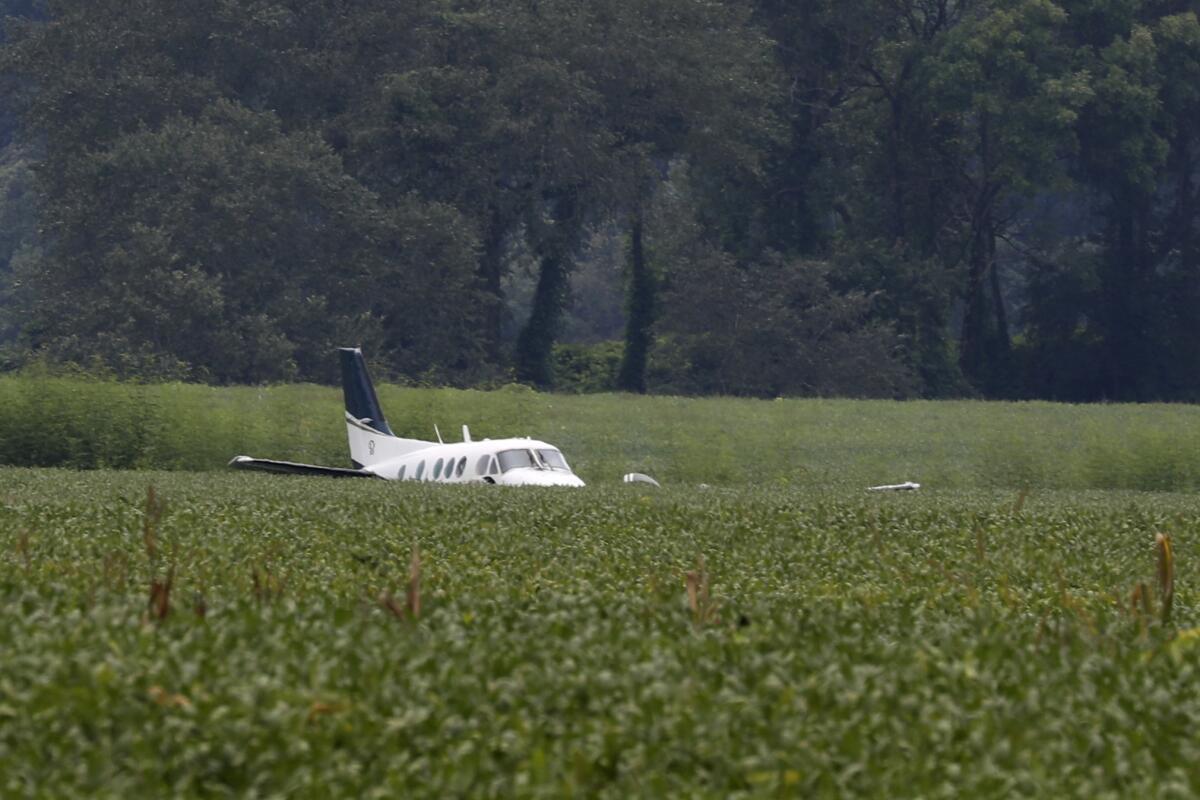 A stolen airplane rests in a field of soybeans after crash-landing near Ripley, Miss., on Saturday, Sept. 3, 2022. Authorities say a man who stole a plane and flew it over Mississippi after threatening to crash it into a Walmart store faces charges of grand larceny and terroristic threats. Tupelo Police Chief John Quaka said Cory Wayne Patterson didn't have a pilot's license but had some flight instruction and was an employee of Tupelo Aviation.(AP Photo/Nikki Boertman)