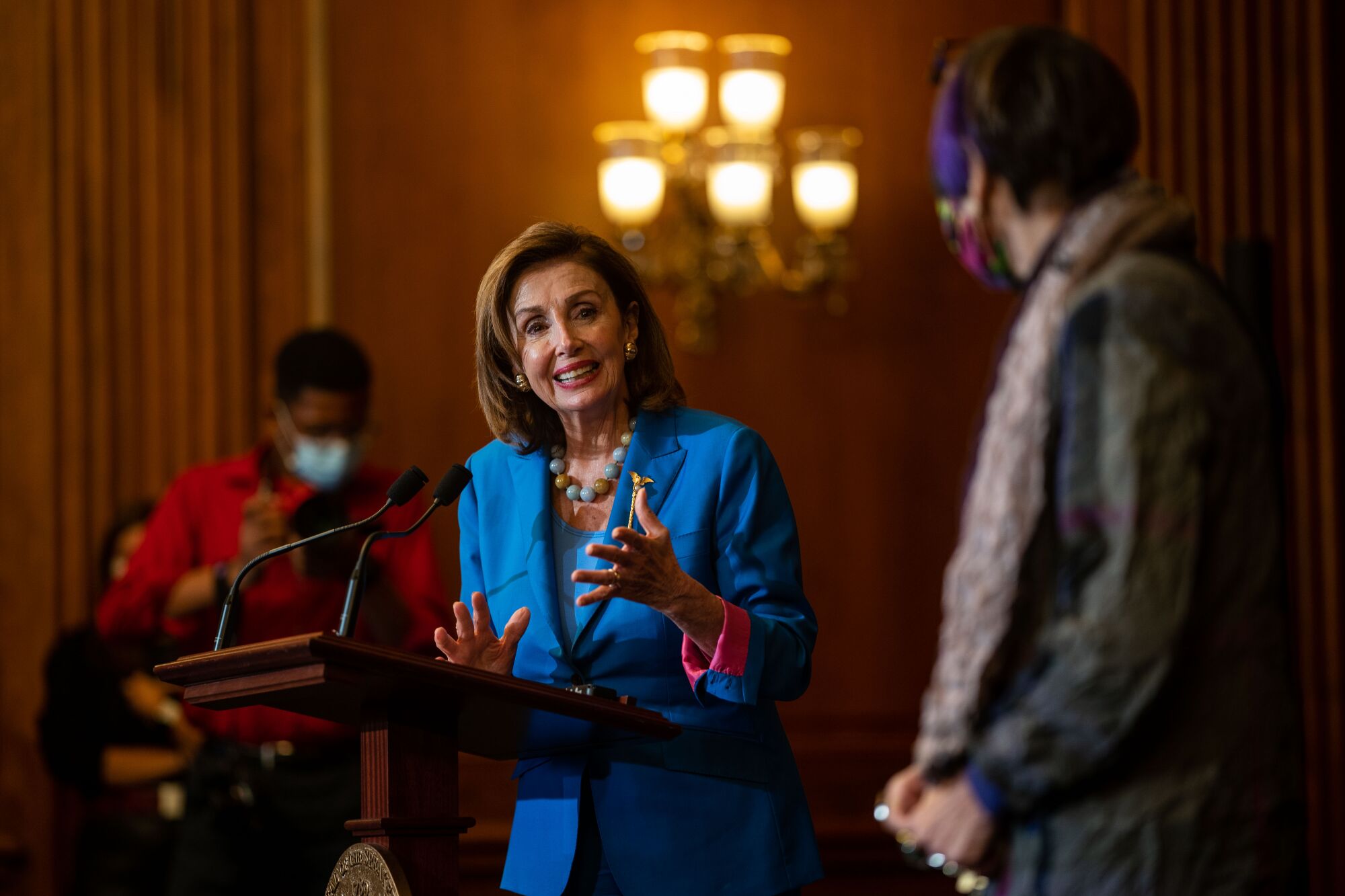Speaker Nancy Pelosi and House members at an event at the Capitol.