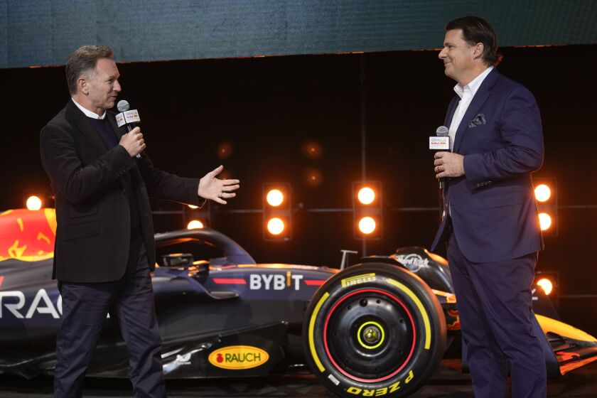 Christian Horner, team principal of the Red Bull Formula One team, left, talks while Ford CEO Jim Farley, right, listens during an Oracle Red Bull Racing event in New York, Friday, Feb. 3, 2023. Ford will return to Formula One as the engine provider for Red Bull Racing in a partnership announced Friday that begins with immediate technical support this season and engines in 2026. (AP Photo/Seth Wenig)