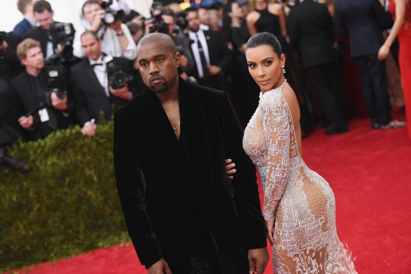 Kanye West and Kim Kardashian walk the Met Gala red carpet in 2015