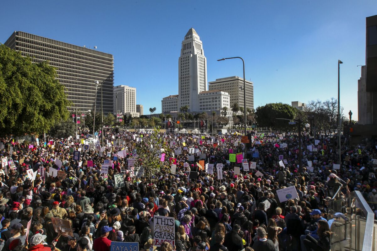 Women's March Los Angeles fills the streets near City Hall and Grand Park on Saturday.