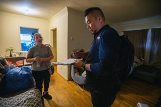 A woman speaks with a therapist about her son in her apartment in Los Angeles. 