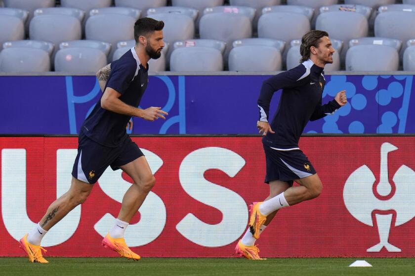 France's Antoine Griezmann, right, and France's Olivier Giroud run during a training session in Munich, Germany, Monday, July 8, 2024. France will play against Spain during their semifinal soccer match at the Euro 2024 soccer tournament on July 9. (AP Photo/Hassan Ammar)