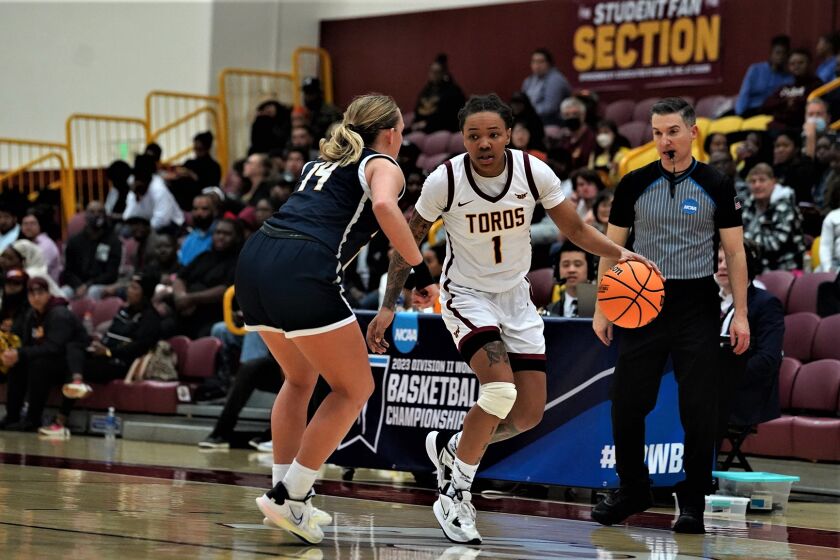 Dawnyel Lair dribbles during a Cal State Dominguez Hills game. 