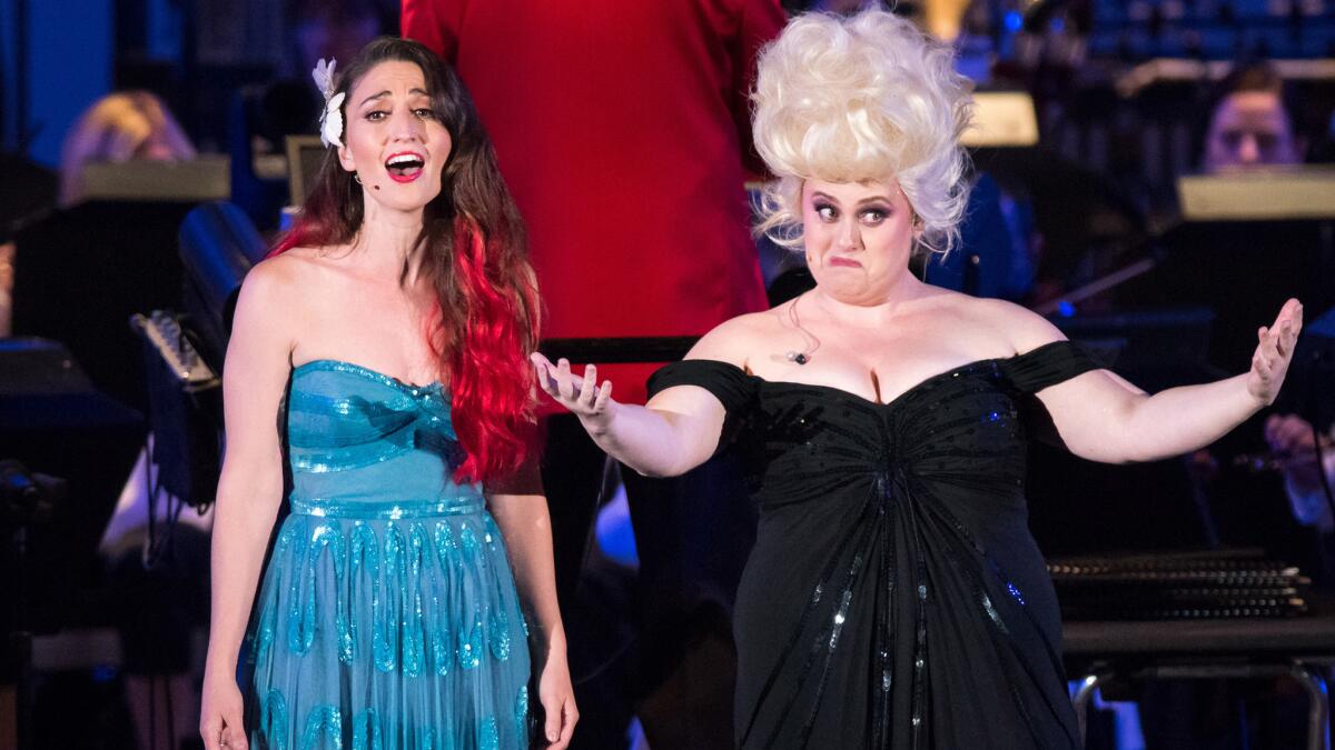 Sara Bareilles, left, sings the role of Ariel, with Rebel Wilson in the role of Ursula at opening night of "Disney's The Little Mermaid in Concert" at the Hollywood Bowl.