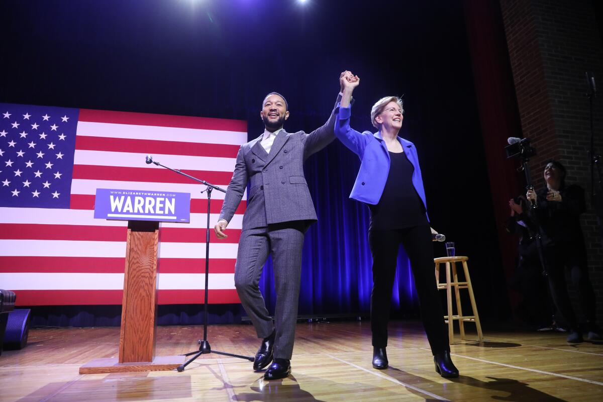 Sen. Elizabeth Warren appears with musician John Legend at a rally at South Carolina State University in Orangeburg on Wednesday. 