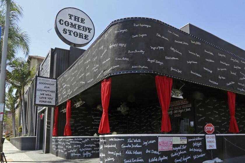 Comedy club, The Comedy Store, adorned with the names of hundreds of great comedians who have passed through its doors, honors founder Mitzi Shore on its marquee, Wednesday, April 11, 2018, in West Hollywood, Calif. Shore, one of the most influential figures in stand-up for more than four decades, died Wednesday at 87. (AP Photo/Reed Saxon)