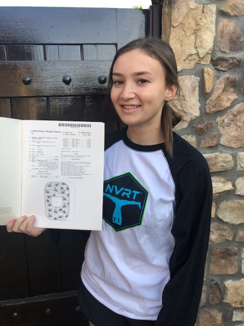 Canyon Crest Academy senior Avery Kay holding her newly acquired patent.