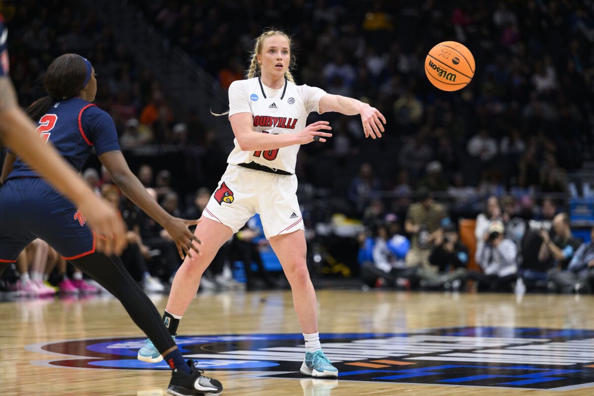 Louisville guard Hailey Van Lith (10) passes the basketball during the second quarter of the team's Sweet 16 college basketball game against Mississippi in the women's NCAA Tournament in Seattle, Friday, March 24, 2023. (AP Photo/Caean Couto)