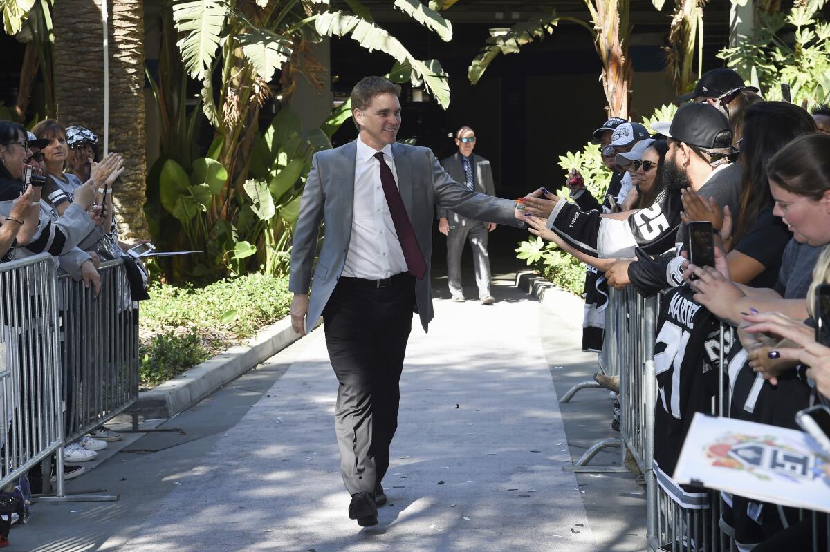 Kings president Luc Robitaille arrives before a game against the Nashville Predators at StaplesCenter on Oct. 12, 2019.