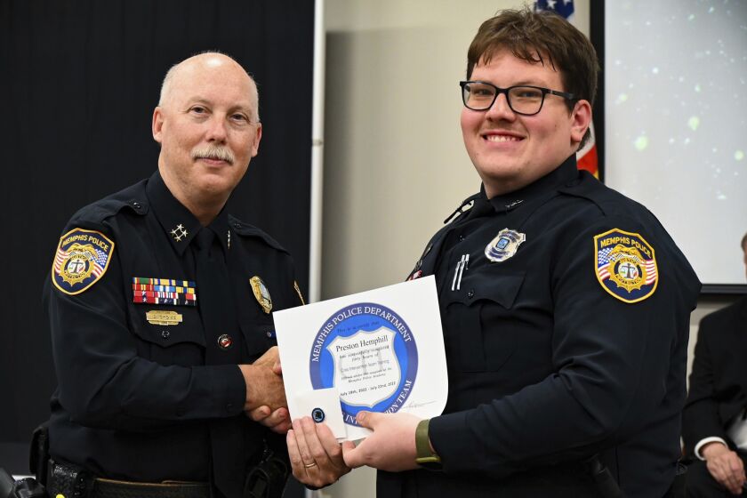 FILE - In this photo obtained from the Memphis, Tenn., Police Department's Facebook page, Preston Hemphill, right, receives a certificate from Memphis Assistant Chief of Police Don Crowe, left, after completing the training to join the department's Crisis Intervention Team on July 21, 2022. Hemphill, the Memphis police officer who hit Nichols with a stun gun during a traffic stop that preceded Nichols’ brutal beating by other officers, won't be charged criminally, a prosecutor said on Tuesday, May 2, 2023. (Memphis Police Department via AP, File)