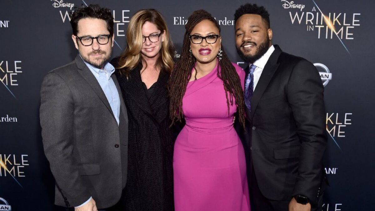 Time's Up members Katie McGrath and Ava DuVernay are flanked by directors JJ Abrams and Ryan Coogler at the world premiere of DuVernay's "A Wrinkle in Time" at the El Capitan Theatre in Hollywood CA on February 26, 2018.