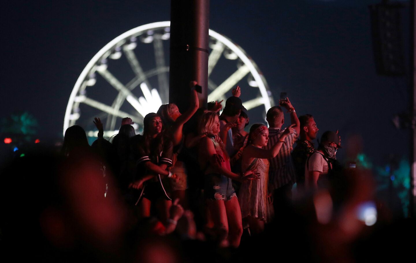 INDIO, CALIF. - APRIL 15, 2017. Fans dance to the music of Future at the Coachella Stage on day two of the Coachella Music and Arts Festival in Indio on Saturday, April 15, 2017. (Luis Sinco/Los Angeles Times)