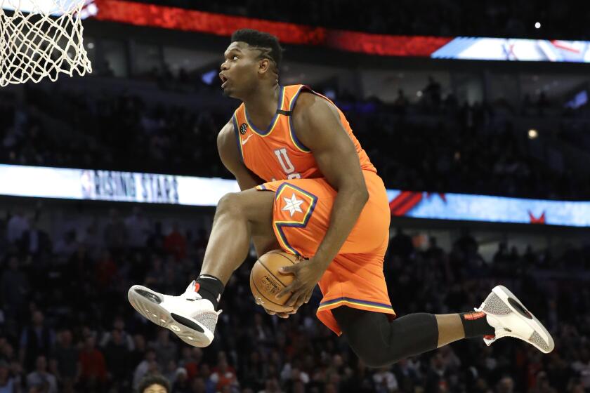 U.S. forward Zion Williamson, of the New Orleans Pelicans, goes up for a dunk during the second half of the NBA Rising Stars basketball game in Chicago, Friday, Feb. 14, 2020. (AP Photo/Nam Y. Huh)
