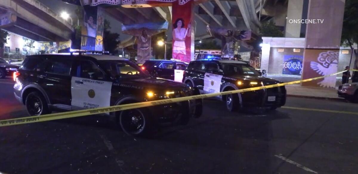 San Diego police vehicles behind yellow tape