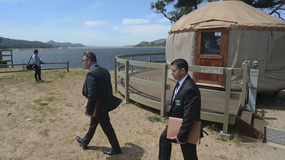 Los Angeles County sheriff's detectives search at Cachuma Lake north of Santa Barbara for a missing 5-year-old boy. (Len Wood / Santa Maria Times)