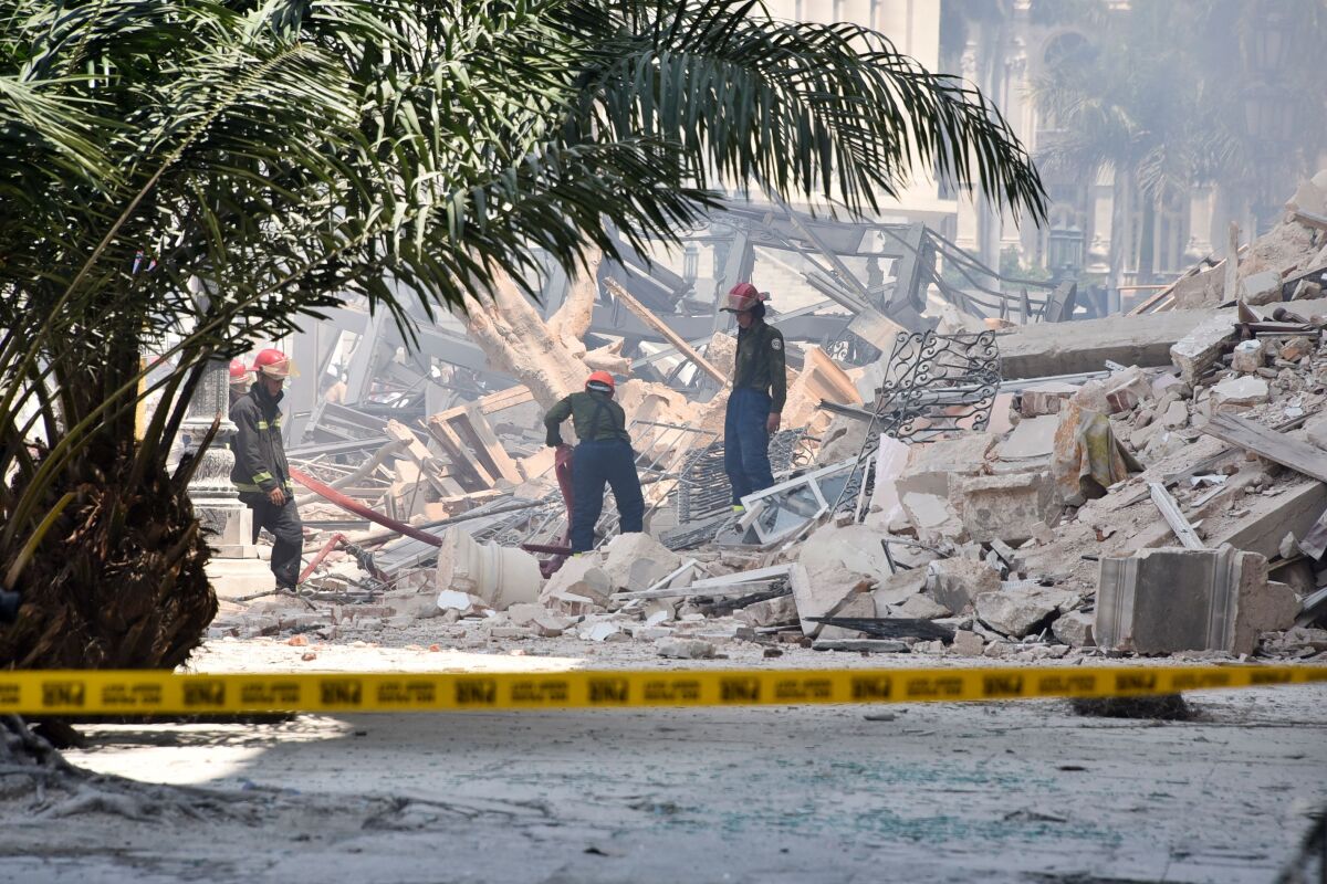 Rescuers work after an explosion at a hotel in Cuba.