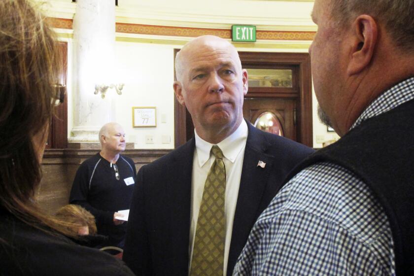 FILE - In this March 6, 2017 file photo technology entrepreneur Greg Gianforte speaks to Republican delegates before a candidate forum in Helena, Mont. Gianforte, charged with shoving a reporter to the ground on the eve of a special election kept a low profile Thursday, May 25, even as supporters prepared a hotel ballroom for a possible victory party. (AP Photo/Matt Volz, File)