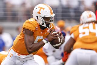 Tennessee quarterback Hendon Hooker (5) runs for yardage during the first half.