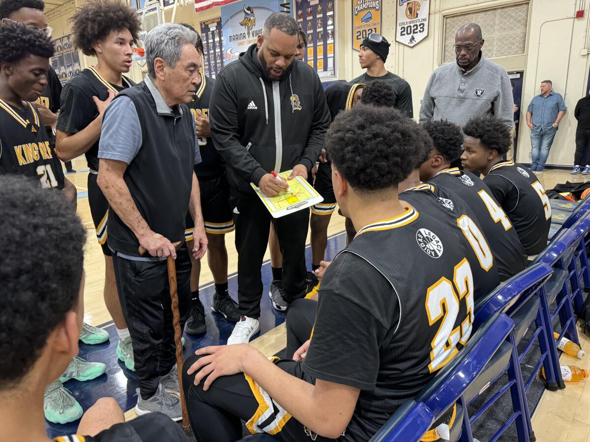 King/Drew coach Lloyd Webster directs his team during a timeout Tuesday against Marina.