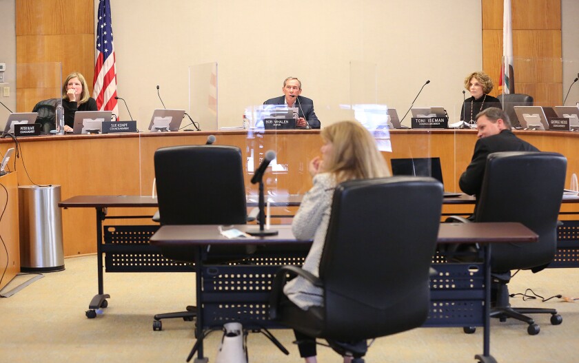 Laguna Beach City Council members Sue Kempf, Bob Whalen and Toni Iseman begin an in-chambers meeting in April 2020.