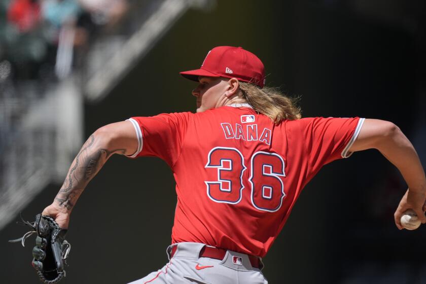 Los Angeles Angels starting pitcher Caden Dana throws during the first inning of a baseball game against the Texas Rangers, Sunday, Sept. 8, 2024, in Arlington, Texas. (AP Photo/LM Otero)