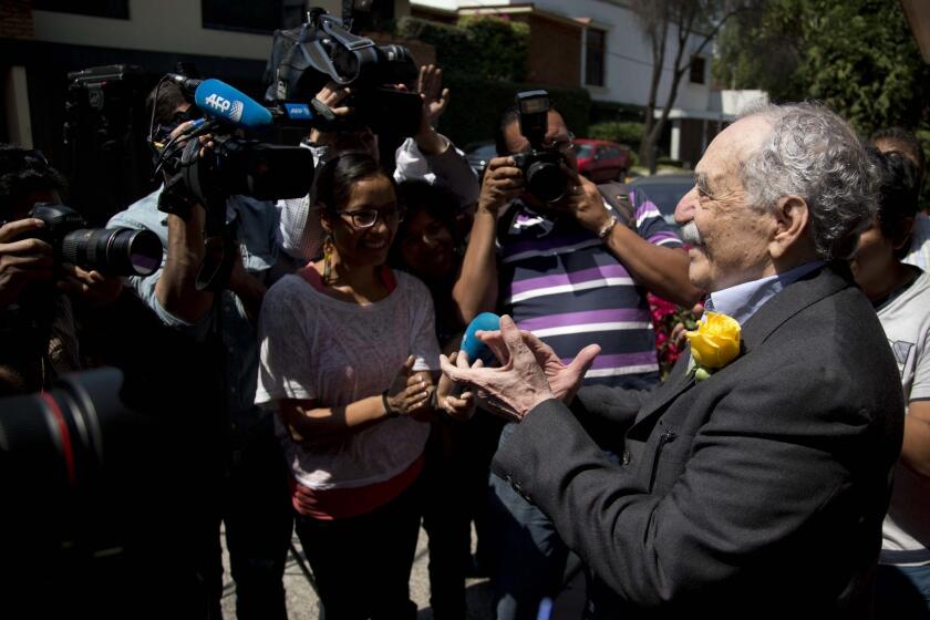 Colombian Nobel literature laureate Gabriel Garcia Marquez meets with fans and reporters outside his Mexico City home on March 6, his 87th birthday.