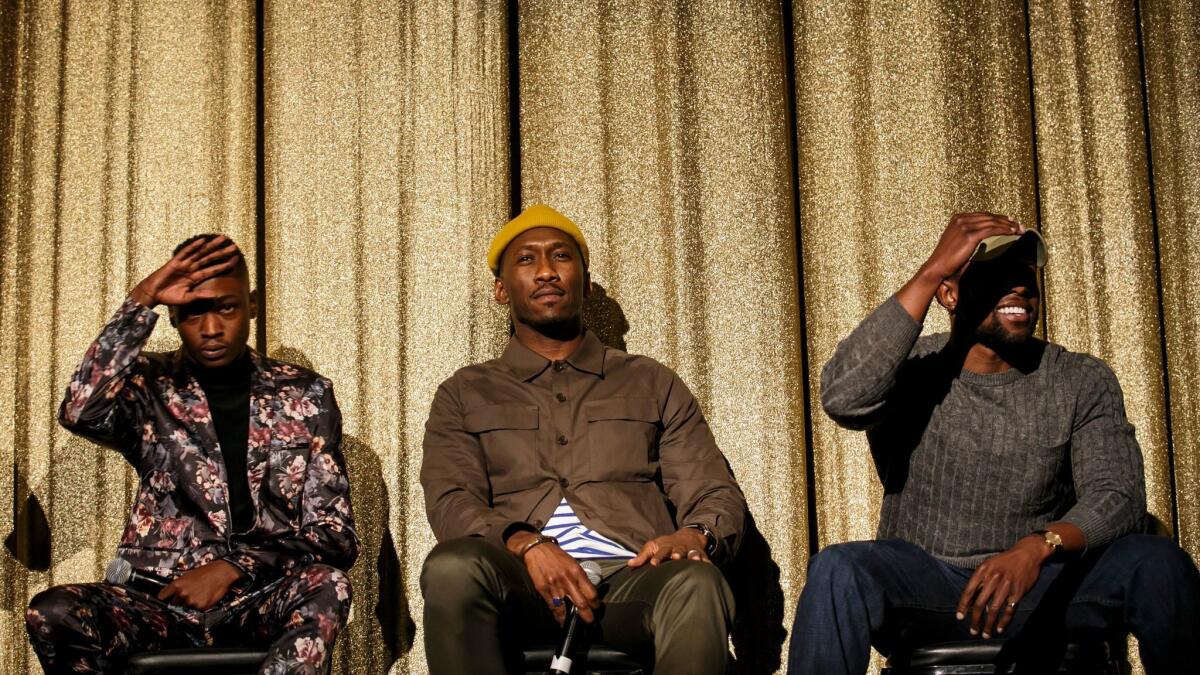 “Moonlight’s” Mahershala Ali is flanked by Ashton Sanders, left, and Trevante Rhodes, two of the three actors who play the central character at different ages.