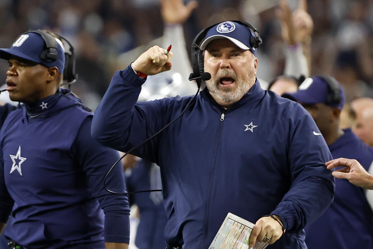 Dallas Cowboys head coach Mike McCarthy, celebrates after running back Tony Pollard ran the ball for a touchdown in the second half of an NFL football game against the Seattle Seahawks in Arlington, Texas, Thursday, Nov. 30, 2023. (AP Photo/Roger Steinman)