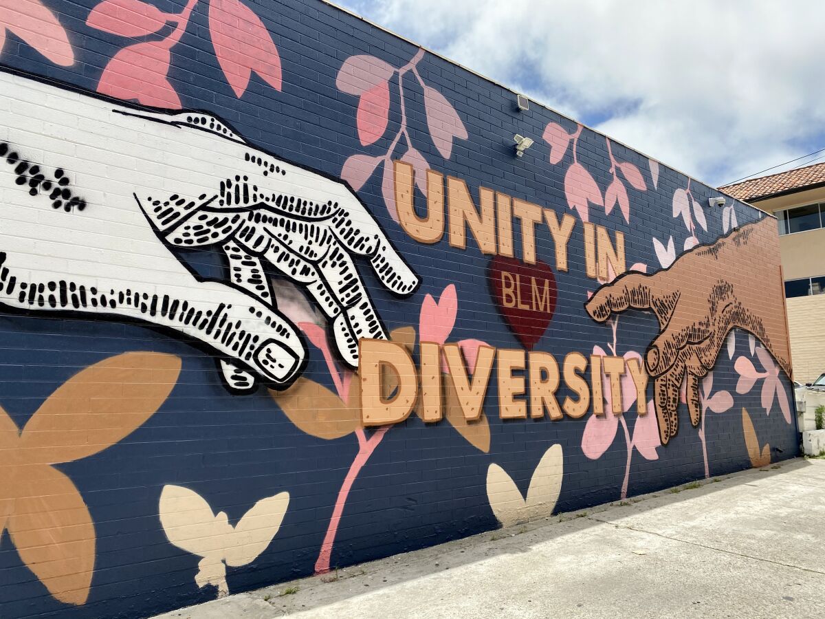 The new "Unity in Diversity" mural covers a wall of CJ Charles Jewelers at 1135 Prospect St. in La Jolla.