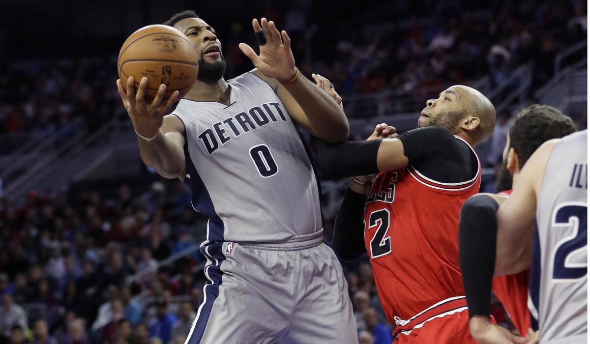 Detroit Pistons center Andre Drummond (0) defended by Chicago Bulls forward Taj Gibson (22), shoots during the second half on Monday.