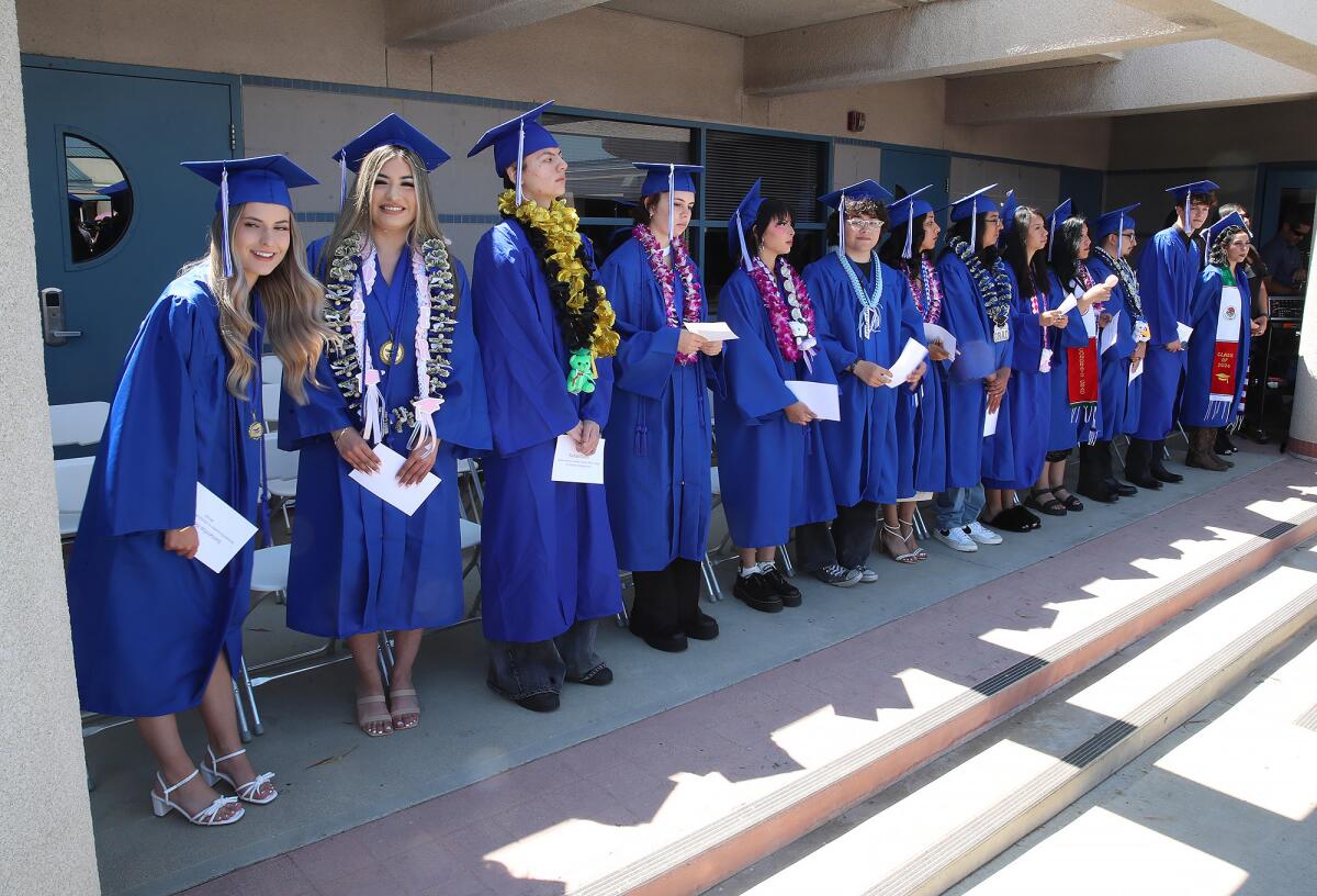 Graduates proudly line up and say hi to parents at the Valley Vista High School commencement ceremony on Thursday.