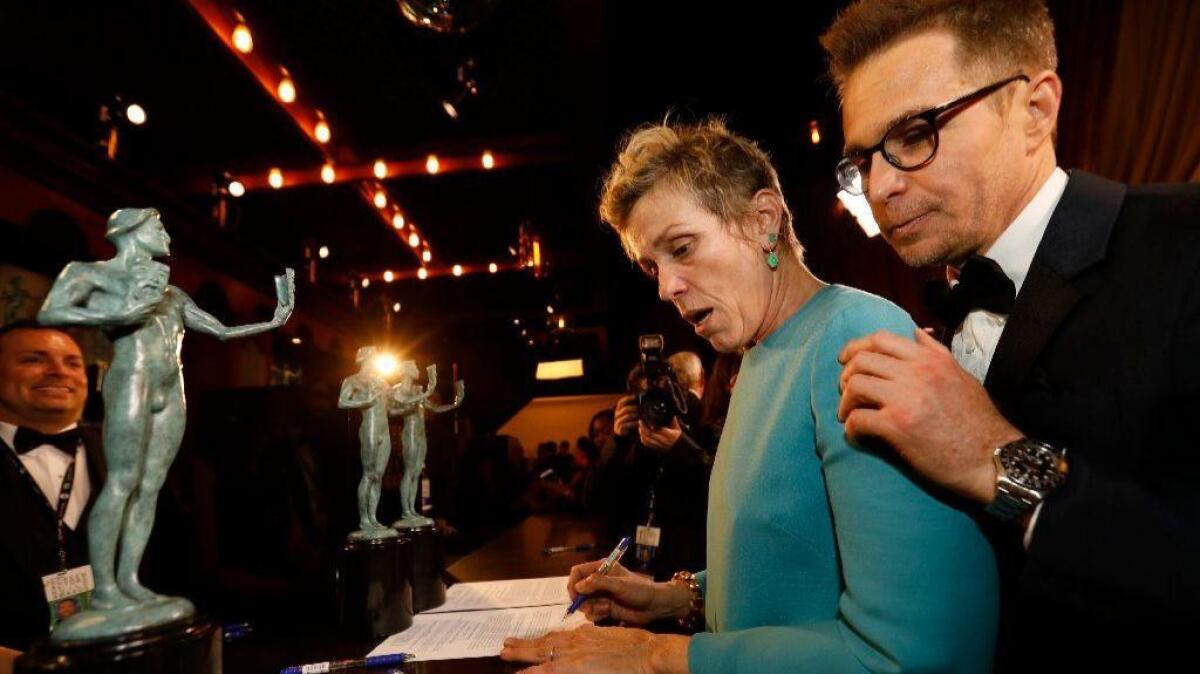 Frances McDormand and Sam Rockwell backstage after "Three Billboards Outside Ebbing, Missouri" won the ensemble prize at the SAG Awards.