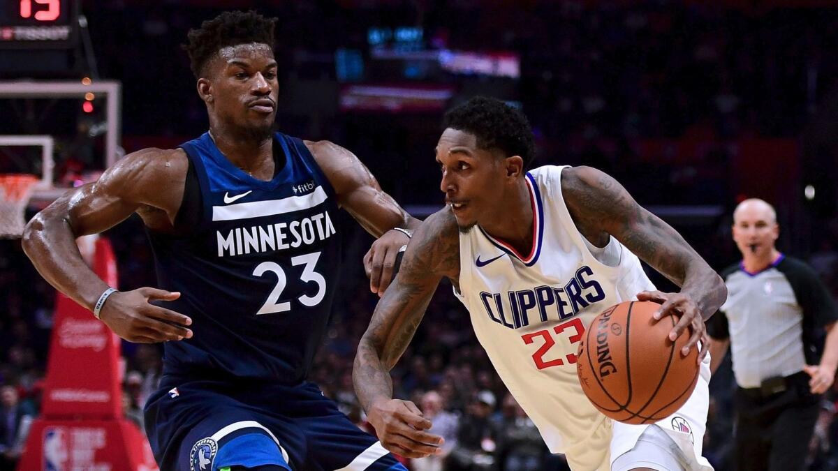 The Clippers' Lou Williams drives to the basket against Minnesota's Jimmy Butler on Dec. 6 at Staples Center.