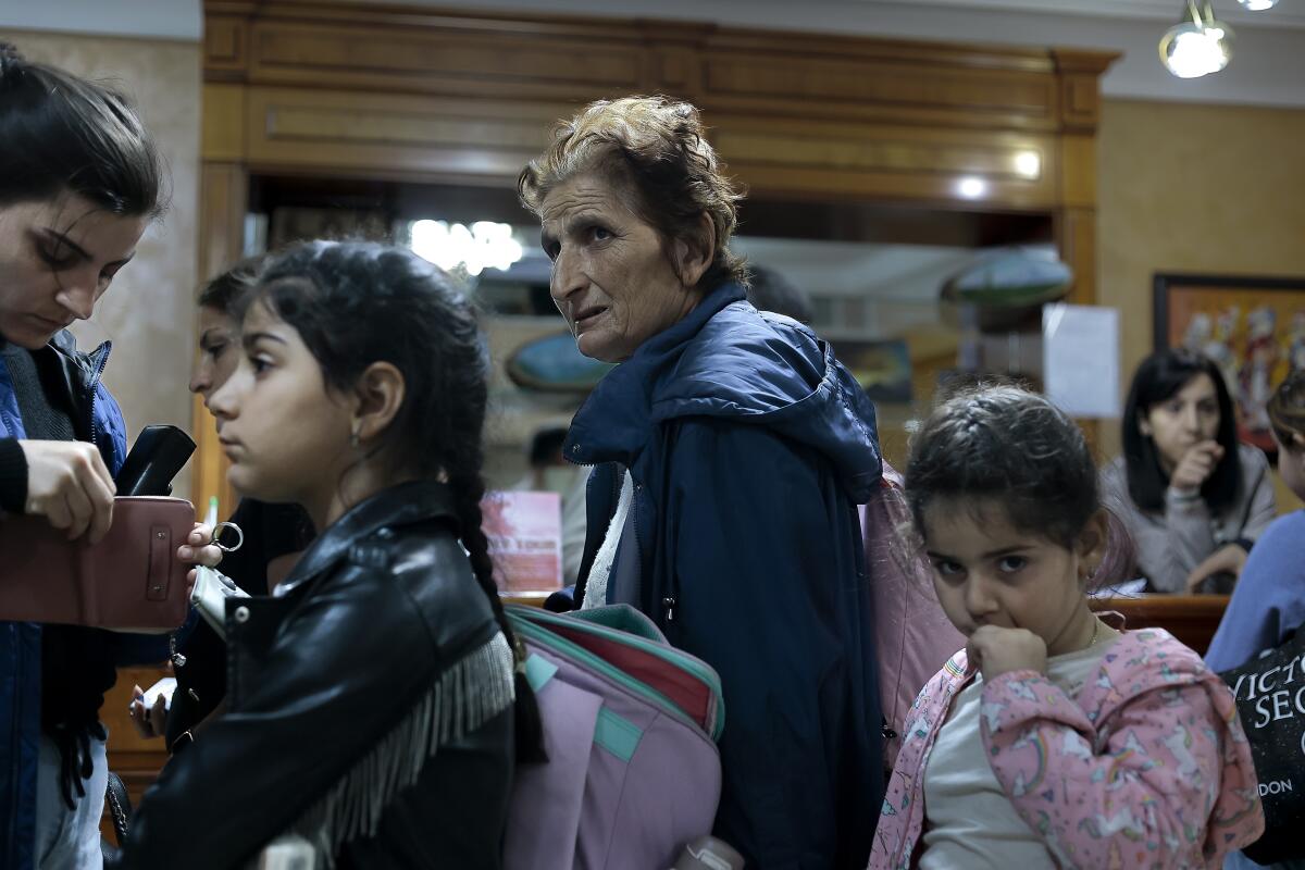 A lady and kids from Nagorno-Karabakh arrive in Armenia.