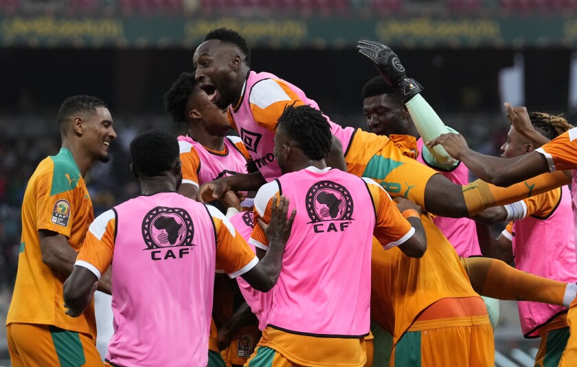 Ivory Coast's players celebrates after Nicolas Pepe scored a goal during the African Cup of Nations 2022 group E soccer match between Ivory Coast and Algeria at the Japoma Stadium in Douala, Cameroon, Thursday, Jan. 20, 2022. (AP Photo/Themba Hadebe)