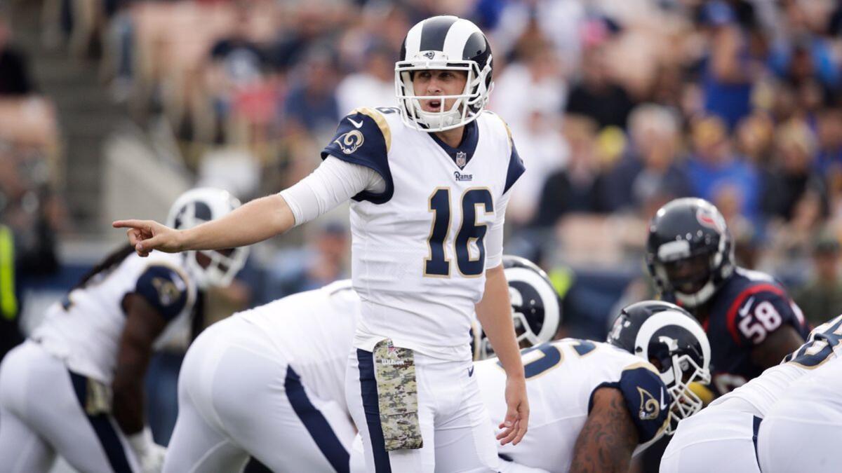 Rams quarterback Jared Goff calls a play against the Houston Texans on Sunday at the Coliseum.